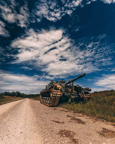 gravel grey battle tank on road during daytime road